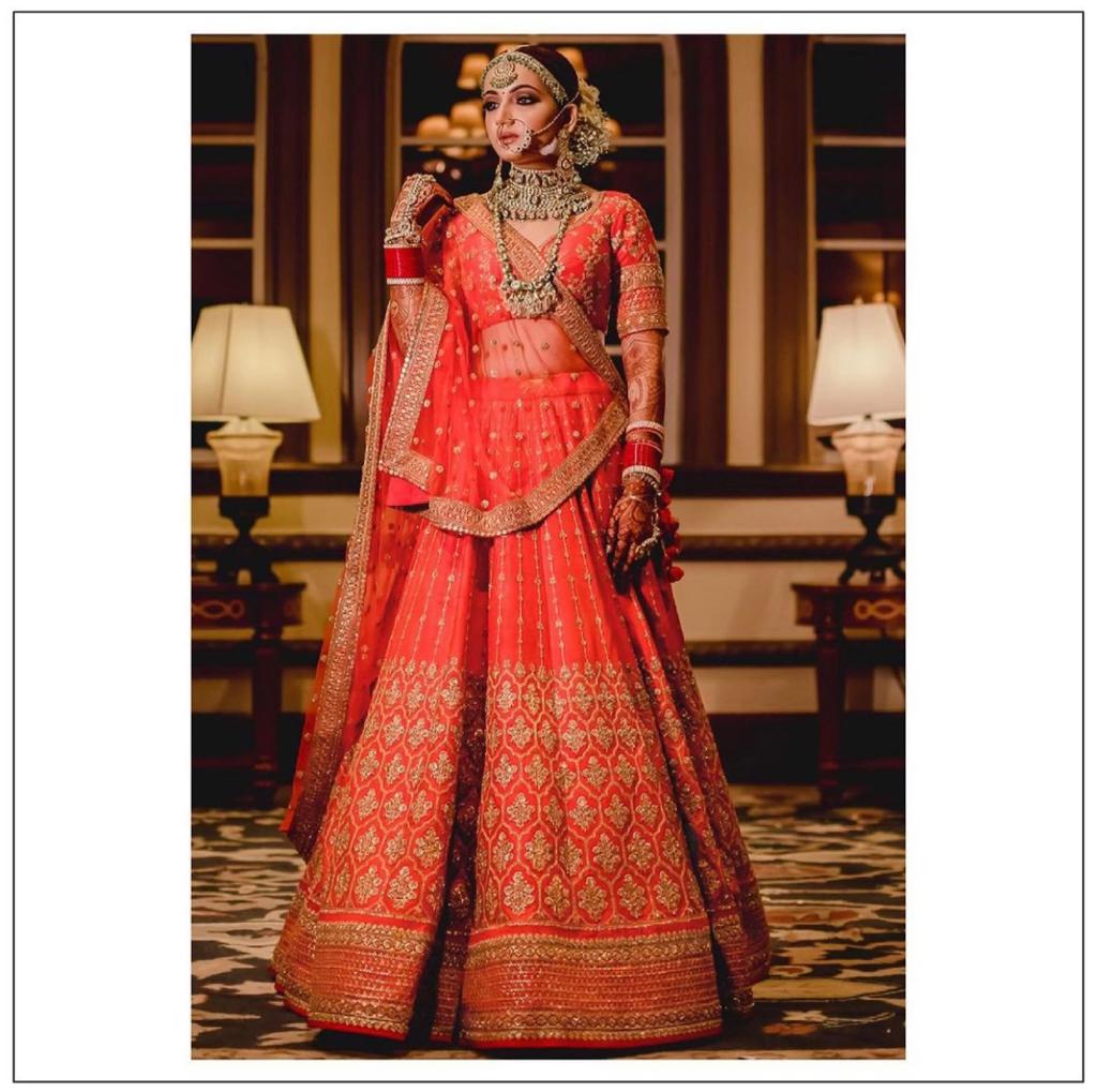 Sabyasachi orange lehenga for bride